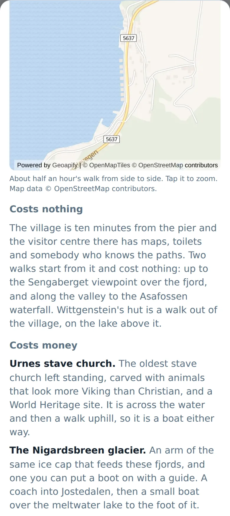 The Skjolden page on a phone, below the street map: under a heading reading Costs nothing, the ten-minute walk to the village and two paths from it, one up to a viewpoint over the fjord and one along the valley to a waterfall. Under Costs money, Urnes stave church across the water and the Nigardsbreen glacier, each with a sentence saying what it is and how you get there.